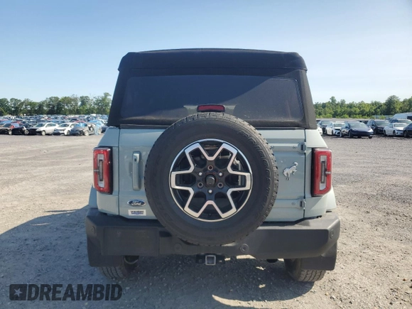 2023 Ford Bronco with VIN 1FMEE5BP0PLC06549, listed as a Copart auction lot 58703305 with 28,051 mi miles and Salvage title. Bid and sale history available at DreamBid. Image 6.