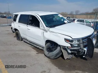 2020 Chevrolet Tahoe Commercial z VIN 1GNSKDEC5LR261015, wystawiony jako IAAI lot #42001083 z przebiegiem 110 668 mil mil oraz . Historia ofert i sprzedaży dostępna na DreamBid. Obrazek 1.