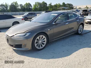 2017 Tesla Model S 100D with VIN 5YJSA1E2XHF173740, listed as a Copart auction lot 62233125 with 73,932 mi miles and Salvage title. Bid and sale history available at DreamBid. Image 1.