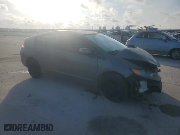2010 Honda Insight EX with VIN JHMZE2H72AS025427, listed as a Copart auction lot 54983775 with 184,052 mi miles and Salvage Title. Bid and sale history available at DreamBid. Image 4.