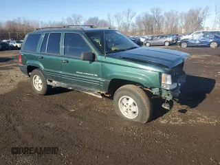 1998 Jeep Grand Cherokee Laredo with VIN 1J4GZ48S4WC239246, listed as a Copart auction lot 86101204 with 0 mi miles and Salvage Title. Bid and sale history available at carsss.com. Image 4.