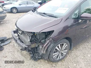 2015 Honda Fit EX z VIN 3HGGK5G80FM751625, wystawiony jako IAAI lot #42427480 z przebiegiem 109 657 mil mil oraz . Historia ofert i sprzedaży dostępna na DreamBid. Obrazek 18.