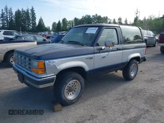 1989 Ford Bronco z VIN 1FMCU14T7KUB49671, wystawiony jako IAAI lot #42404266 z przebiegiem 22 883 mil mil oraz . Historia ofert i sprzedaży dostępna na DreamBid. Obrazek 2.