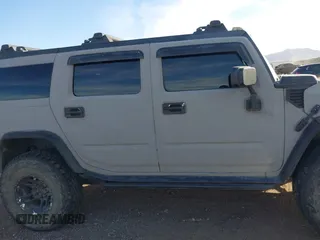 2003 Hummer H2 with VIN 5GRGN23U13H128617, listed as a IAAI auction lot 41494349 with 135,295 mi miles. Bid and sale history available at carsss.com. Image 13.