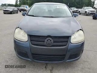 2009 Volkswagen Jetta SE with VIN 3VWRZ71K59M055735, listed as a Copart auction lot 60202485 with 160,196 mi miles and Salvage title. Bid and sale history available at DreamBid. Image 5.