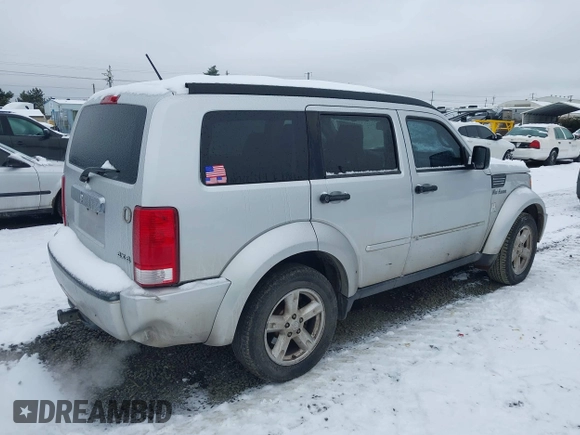 2007 Dodge Nitro SLT with VIN 1D8GU58K07W734541, listed as a IAAI auction lot 41556413 with 221,119 mi miles. Bid and sale history available at carsss.com. Image 4.