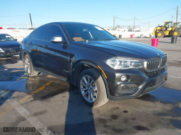 2019 BMW X6 sDrive35i with VIN 5UXKU0C57K0S97581, listed as a IAAI auction lot 41322568 with 76,635 mi miles. Bid and sale history available at carsss.com. Image 1.