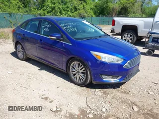 2015 Ford Focus Titanium with VIN 1FADP3J20FL304828, listed as a IAAI auction lot 42144101 with 199,715 mi miles and . Bid and sale history available at carsss.com. Image 1.