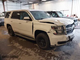 2018 Chevrolet Tahoe Commercial with VIN 1GNSKDEC7JR240082, listed as a IAAI auction lot 41608557 with 111,834 mi miles. Bid and sale history available at carsss.com. Image 1.