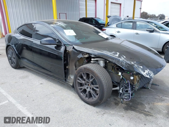 2023 Tesla Model S with VIN 5YJSA1E52PF528795, listed as a IAAI auction lot 42110660 with 21,243 mi miles and . Bid and sale history available at DreamBid. Image 1.