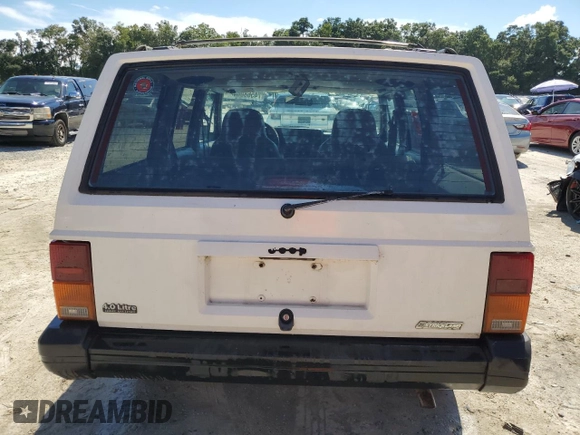 1996 Jeep Cherokee Sport with VIN 1J4FT68S4TL131956, listed as a Copart auction lot 74568064 with 174,014 mi miles and Non Repairable. Bid and sale history available at carsss.com. Image 6.