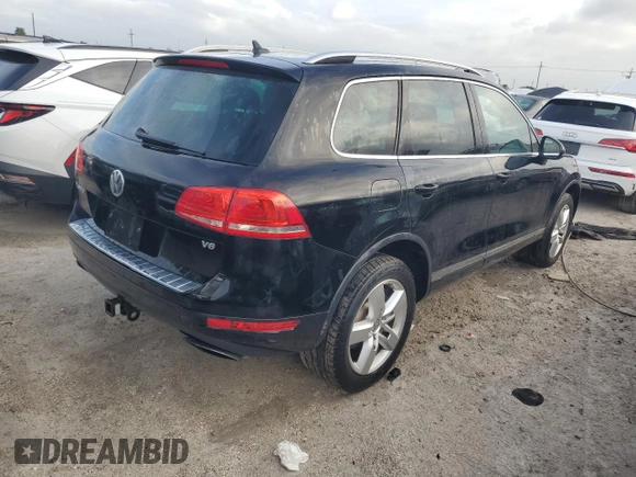 2012 Volkswagen Touareg Exec with VIN WVGEF9BP1CD011407, listed as a Copart auction lot 79199754 with 57,376 mi miles and Salvage Title. Bid and sale history available at DreamBid. Image 3.