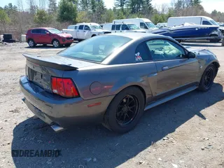2004 Ford Mustang GT Deluxe with VIN 1FAFP42X44F142786, listed as a IAAI auction lot 42095619 with 100,020 mi miles and . Bid and sale history available at DreamBid. Image 4.