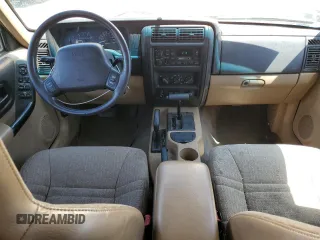 1999 Jeep Cherokee Sport z VIN 1J4FF68S7XL553295, wystawiony jako Copart lot #62390915 z przebiegiem 358 587 mil mil oraz Czysty tytuł • Clean title. Historia ofert i sprzedaży dostępna na DreamBid. Obrazek 8.