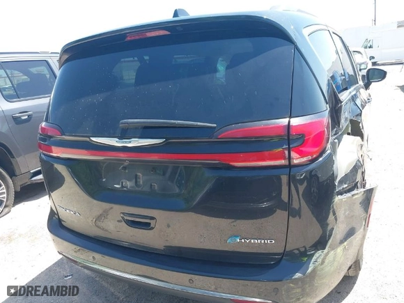 2021 Chrysler Pacifica Hybrid Touring L with VIN 2C4RC1L73MR599629, listed as a IAAI auction lot 42013823 with 62,886 mi miles. Bid and sale history available at carsss.com. Image 16.