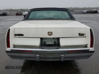 1994 Cadillac Fleetwood z VIN 1G6DW52PXRR717413, wystawiony jako Copart lot #84355464 z przebiegiem 143 507 mil mil oraz Tytuł czysty. Historia ofert i sprzedaży dostępna na DreamBid. Obrazek 6.