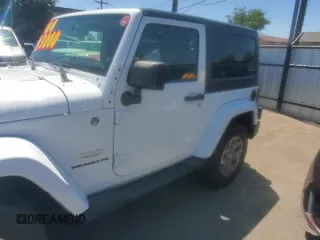 2014 Jeep Wrangler Sahara z VIN 1C4AJWBG3EL197444, wystawiony jako Copart lot #64733055 z przebiegiem 193 278 mil mil oraz Czysty tytuł • Clean title. Historia ofert i sprzedaży dostępna na DreamBid. Obrazek 11.