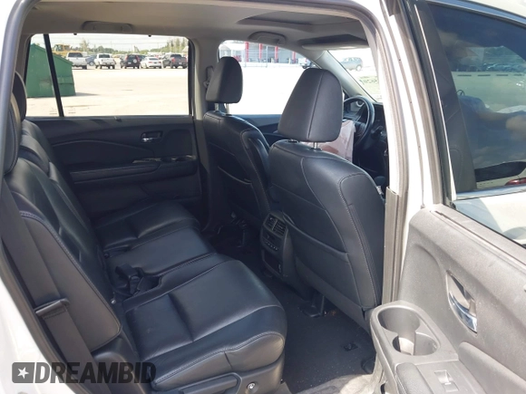 2020 Honda Pilot EX-L with VIN 5FNYF5H59LB028268, listed as a IAAI auction lot 42355620 with 107,033 mi miles and . Bid and sale history available at DreamBid. Image 8.