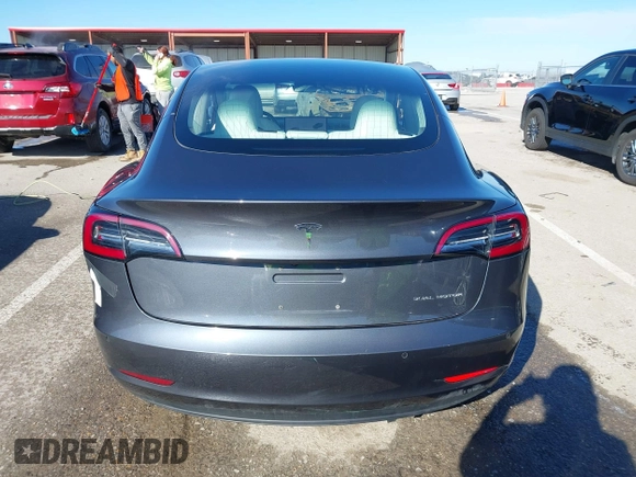 2018 Tesla Model 3 Long Range Battery with VIN 5YJ3E1EB6JF122167, listed as a IAAI auction lot 41761710 with 76,199 mi miles and . Bid and sale history available at DreamBid. Image 16.