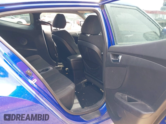 2014 Hyundai Veloster with VIN KMHTC6AD2EU184927, listed as a IAAI auction lot 42133499 with 103,499 mi miles. Bid and sale history available at carsss.com. Image 8.