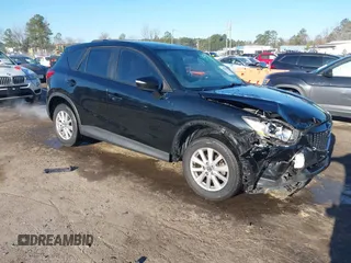 2015 Mazda CX-5 Sport z VIN JM3KE2BE1F0552136, wystawiony jako IAAI lot #41750481 z przebiegiem 189 377 mil mil oraz . Historia ofert i sprzedaży dostępna na DreamBid. Obrazek 1.