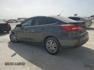 2016 Ford Focus Titanium with VIN 1FADP3J20GL274263, listed as a Copart auction lot 48340175 with 114,941 mi miles and Salvage title. Bid and sale history available at DreamBid. Image 2.