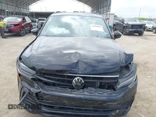 2023 Volkswagen Tiguan SE R-Line Black with VIN 3VVCB7AX0PM122636, listed as a IAAI auction lot 42040494 with 8,589 mi miles and . Bid and sale history available at DreamBid. Image 12.