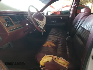 1994 Lincoln Town Car Executive z VIN 1LNLM81W9RY755340, wystawiony jako Copart lot #68571884 z przebiegiem 167 150 mil mil oraz Szkody całkowita. Historia ofert i sprzedaży dostępna na DreamBid. Obrazek 7.