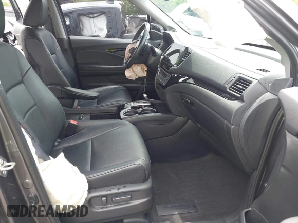 2019 Honda Pilot Touring 8-Passenger with VIN 5FNYF5H93KB028641, listed as a IAAI auction lot 42524078 with 56,744 mi miles and . Bid and sale history available at DreamBid. Image 5.