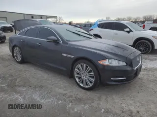 2013 Jaguar XJ with VIN SAJWA1C70D8V41578, listed as a Copart auction lot 89080585 with 76,063 mi miles and Salvage Title. Bid and sale history available at DreamBid. Image 4.