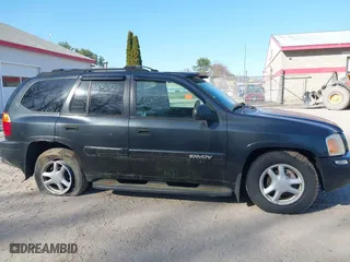 2005 GMC Envoy SLE with VIN 1GKDT13S852116252, listed as a IAAI auction lot 42086929 with 1 mi miles. Bid and sale history available at carsss.com. Image 14.