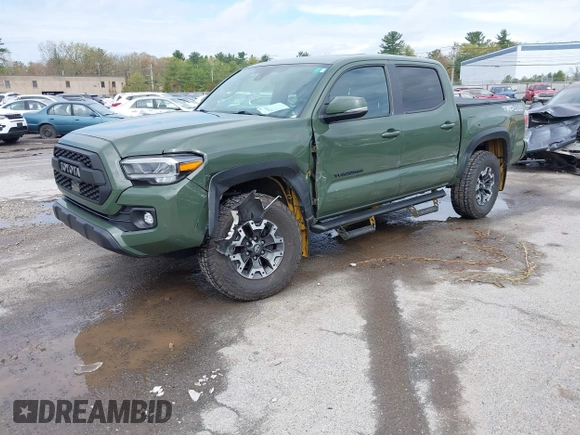 2021 Toyota Tacoma SR with VIN 3TMCZ5AN5MM380286, listed as a IAAI auction lot 42165523 with 58,965 mi miles and . Bid and sale history available at DreamBid. Image 2.