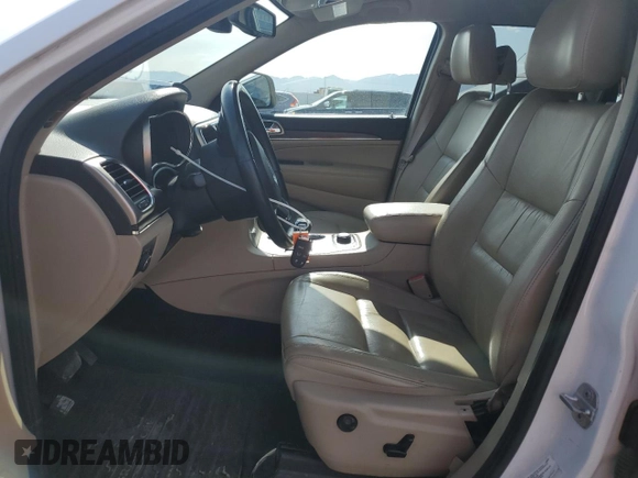 2014 Jeep Grand Cherokee Limited with VIN 1C4RJFBG4EC299273, listed as a Copart auction lot 59660695 with 162,528 mi miles and Salvage title. Bid and sale history available at DreamBid. Image 7.