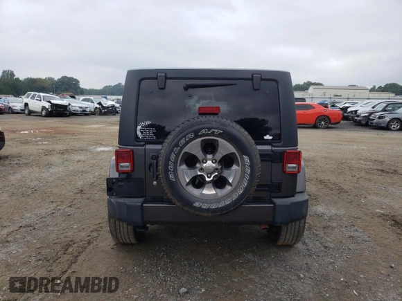 2018 Jeep Wrangler JK Unlimited Sahara with VIN 1C4HJWEG7JL909023, listed as a Copart auction lot 72774404 with 106,801 mi miles and Salvage Title. Bid and sale history available at carsss.com. Image 6.