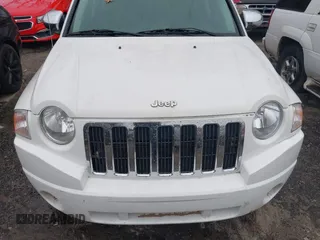 2007 Jeep Compass Sport with VIN 1J8FT47W27D256252, listed as a IAAI auction lot 41616554 with 210,125 mi miles. Bid and sale history available at carsss.com. Image 6.