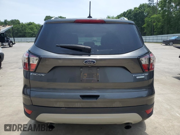 2018 Ford Escape Titanium with VIN 1FMCU0J93JUB20136, listed as a Copart auction lot 56841065 with 129,954 mi miles and Salvage title. Bid and sale history available at DreamBid. Image 6.