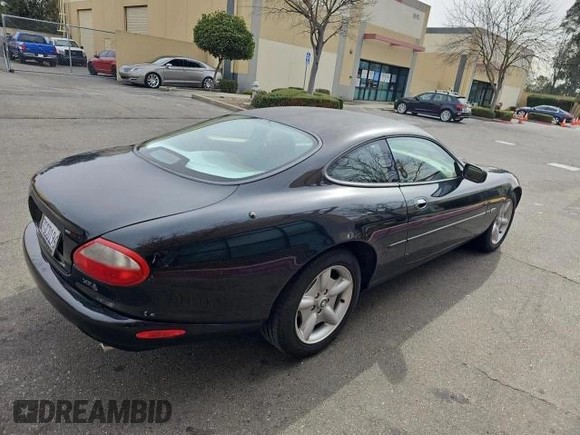 1997 Jaguar XK with VIN SAJGX5747VC007213, listed as a Copart auction lot 45953175 with 82,461 mi miles and Clean Title. Bid and sale history available at DreamBid. Image 4.