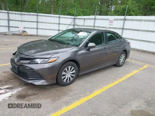 2019 Toyota Camry Hybrid LE z VIN 4T1B31HK4KU511360, wystawiony jako IAAI lot #42298260 z przebiegiem 133 019 mil mil oraz . Historia ofert i sprzedaży dostępna na DreamBid. Obrazek 2.