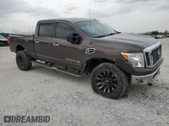 2017 Nissan Titan Platinum Reserve z VIN 1N6BA1F48HN513661, wystawiony jako Copart lot #53576075 z przebiegiem 93 430 mil mil oraz Szkoda całkowita • Salvage title. Historia ofert i sprzedaży dostępna na DreamBid. Obrazek 4.