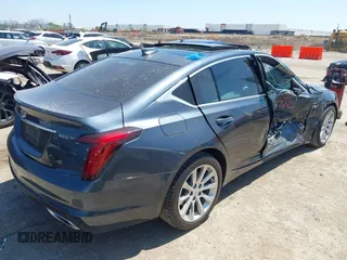 2021 Cadillac CT5 Luxury z VIN 1G6DW5RKXM0144424, wystawiony jako IAAI lot #41985803 z przebiegiem 65 555 mil mil oraz . Historia ofert i sprzedaży dostępna na DreamBid. Obrazek 4.