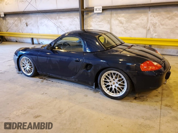 1999 Porsche Boxster z VIN WP0CA2983XU630435, wystawiony jako Copart lot #47402785 z przebiegiem 62 180 mil mil oraz Szkoda całkowita • Salvage title. Historia ofert i sprzedaży dostępna na DreamBid. Obrazek 2.
