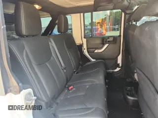 2016 Jeep Wrangler Unlimited Sahara с VIN 1C4HJWEG3GL346528, выставлен на аукционе Copart как лот 65092755 с пробегом 127 393 миль миль и Списание • Salvage title. История ставок и продаж доступна на DreamBid. Изображение 11.