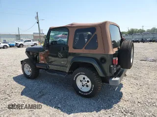 1997 Jeep Wrangler Sahara with VIN 1J4FY49S3VP519387, listed as a Copart auction lot 63822395 with 187,884 mi miles and Salvage title. Bid and sale history available at DreamBid. Image 2.
