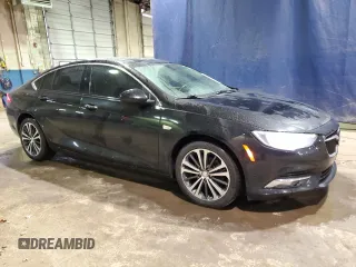 2018 Buick Regal Essence with VIN W04GP6SX8J1047130, listed as a Copart auction lot 50153395 with 97,679 mi miles and Clean title. Bid and sale history available at DreamBid. Image 4.