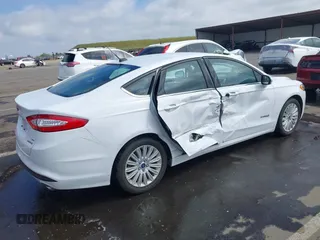 2016 Ford Fusion SE Hybrid with VIN 3FA6P0LU7GR397310, listed as a IAAI auction lot 42075891 with 124,879 mi miles. Bid and sale history available at carsss.com. Image 4.