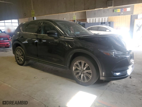 2021 Mazda CX-5 Grand Touring with VIN JM3KFADMXM1383186, listed as a Copart auction lot 41784755 with 50,038 mi miles and Salvage Title. Bid and sale history available at carsss.com. Image 4.