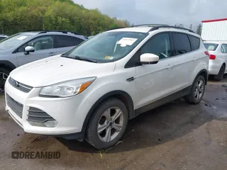 2015 Ford Escape SE with VIN 1FMCU9G91FUB27234, listed as a IAAI auction lot 42157947 with 210,034 mi miles. Bid and sale history available at carsss.com. Image 2.