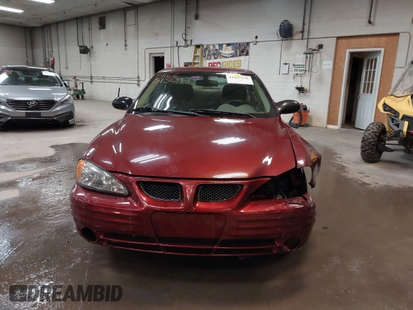 2002 Pontiac Grand Am SE z VIN 1G2NE52F92C291335, wystawiony jako IAAI lot #41665150 z przebiegiem 75 552 mil mil oraz . Historia ofert i sprzedaży dostępna na DreamBid. Obrazek 13.