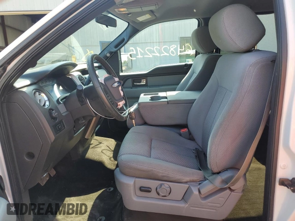 2014 Ford F-150 XL with VIN 1FTFW1EF3EFC97880, listed as a Copart auction lot 64822215 with 105,437 mi miles and Salvage title. Bid and sale history available at DreamBid. Image 7.