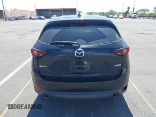2018 Mazda CX-5 Touring z VIN JM3KFACM5J0309533, wystawiony jako IAAI lot #42195429 z przebiegiem 91 928 mil mil oraz . Historia ofert i sprzedaży dostępna na DreamBid. Obrazek 16.